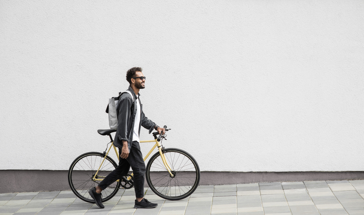 Man walking his bike